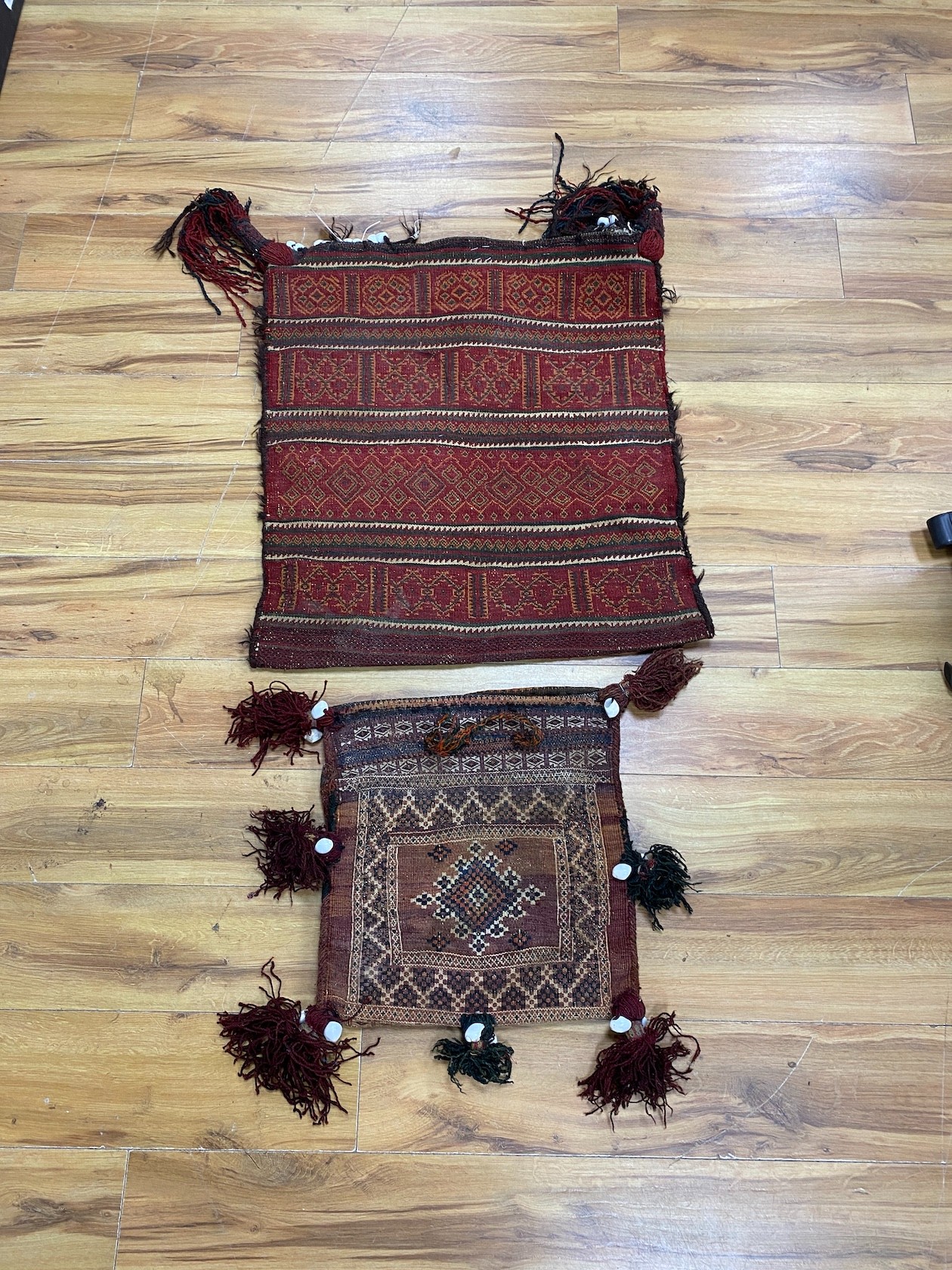 Two Afghan polychrome saddlebags, larger 64 x 70cm